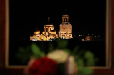 a view of a building at night at Cathedral Apartment Varna in Varna City