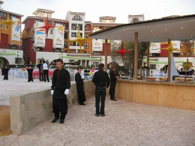 a group of men standing in a courtyard at Visit Sunny Beach Marina Apartments in Ravda