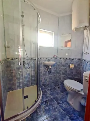 a bathroom with a shower and a toilet and a sink at Vega Village Ap B39 in Sveti Vlas