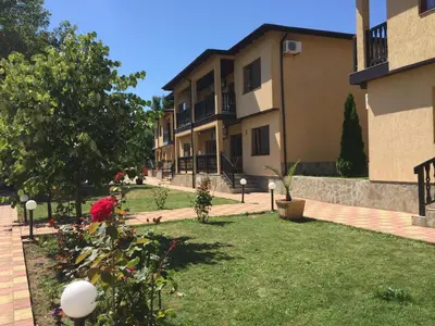 a courtyard of a building with trees and plants at Complex Terazini in Byala