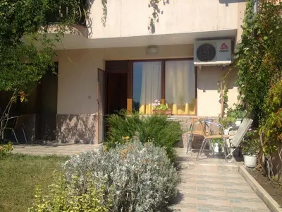 a house with a garden and a patio at Guest House Maria in Nesebar