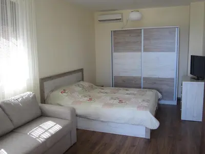a small bedroom with a bed and a couch at Vis Velika in Velika