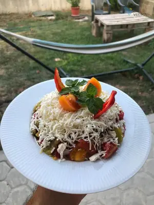 a plate of food with pasta and vegetables on it at Vis Velika in Velika