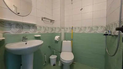 a bathroom with a toilet and a sink at Estreya in Tsarevo