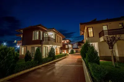 a house at night with a driveway at Villas in Complex Trakiyskiy Bryag in Lozenets