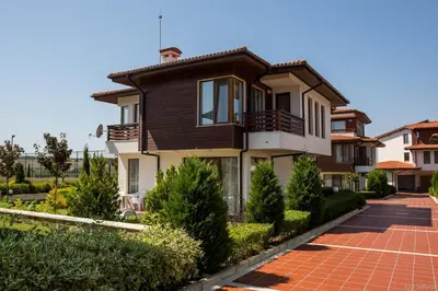 a house with a brick driveway in front of it at Villas in Complex Trakiyskiy Bryag in Lozenets
