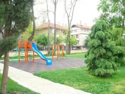 a playground with a slide in a park at Dom Eli in Pomorie
