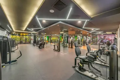 a gym with many treadmills and machines in it at Grand Hotel Sveti Vlas - Fitness & SPA Hotel in Sveti Vlas