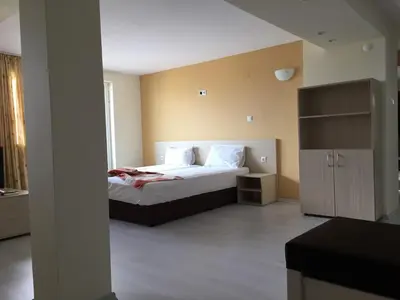 a bedroom with a bed in a room at Aparthotel Lucky Family in Ravda