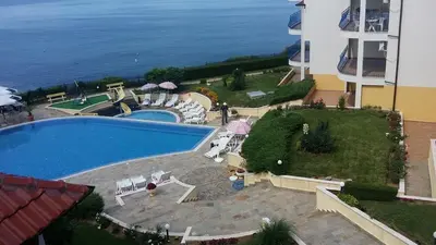 an aerial view of a swimming pool next to the ocean at Apartments in Complex Panorama in Sozopol