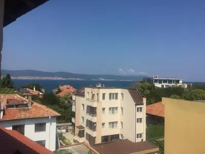 a view of a city with buildings and the water at Guest House Briz in Nesebar