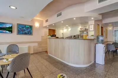a bar in a restaurant with chairs and a counter at Paraiso Theopolis - All Inclusive in Obzor