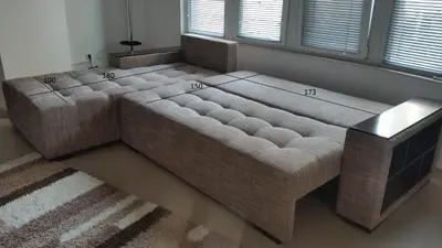 a large bed sitting in a room with two windows at 4U Apartment in Burgas City