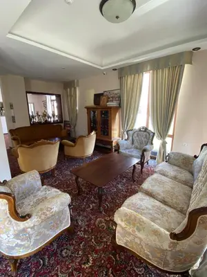 a living room with a couch and chairs and a table at Hotel Aristokrat in Obzor