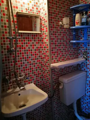 a bathroom with a toilet and a sink at Sadala Guest House in Nesebar