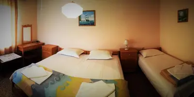 a bedroom with two beds and a sink in it at Atanasovi House in Shkorpilovtsi