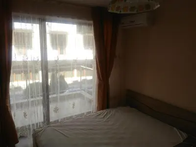 a bedroom with a bed and a window at Sea'n'Pool Apartments in Hotel in Sozopol