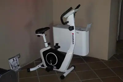 a white exercise bike parked next to a trash can at Budzhaka Villa in Sozopol