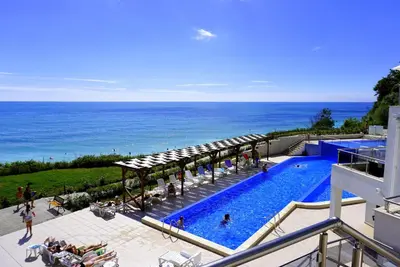 a swimming pool with a view of the ocean at Бяла Виста Клиф - Byala Vista Cliff in Byala
