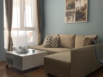 a living room with a couch and a coffee table at Бяла Виста Клиф - Byala Vista Cliff in Byala