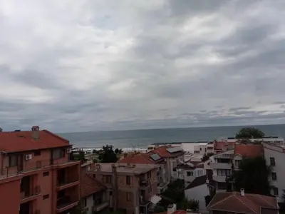 a view of a city with buildings and the ocean at Zlatevi Guest House in Obzor