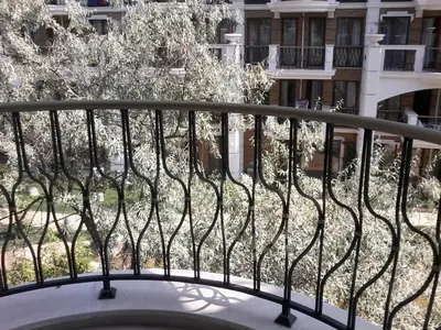 a balcony with a view of a building at Private Apartments in Harmony Suites Dream Island in Sunny Beach