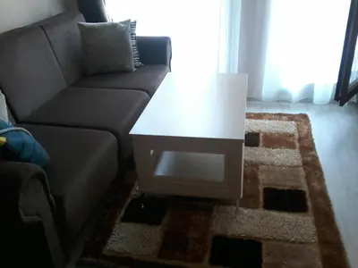 a living room with a couch and a coffee table at Private Apartments in Harmony Suites Dream Island in Sunny Beach