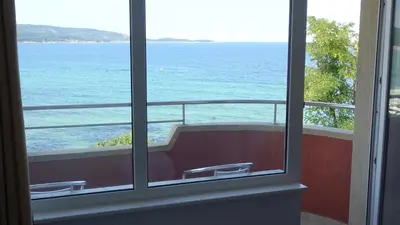 a view of the ocean from a window at Dobrevi Guest House in Primorsko