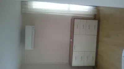 a closet with white cabinets and a window at Casa del Sol Apartments in Sunny Beach