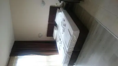 a stairway with a white stove in a room at Casa del Sol Apartments in Sunny Beach