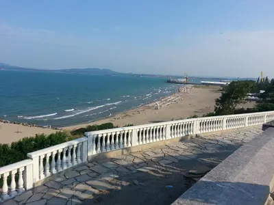 a view of a beach with a white fence at Sea Garden in Burgas City