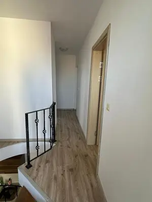an empty room with a hallway leading to a stairway at Maisonette Sevastiyan in Varna City