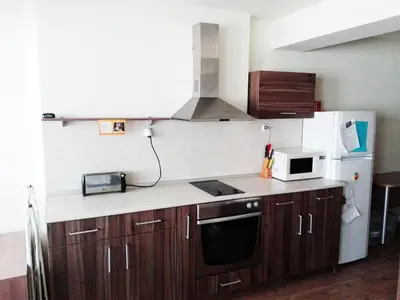 a kitchen with a microwave and a refrigerator at Maisonette Sevastiyan in Varna City