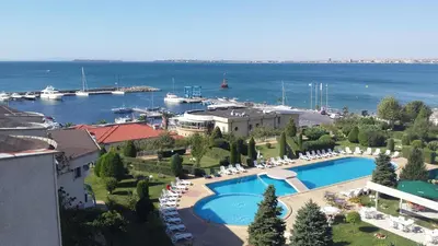 an aerial view of a resort with a pool and a marina at Riviera Complex 6 in Sveti Vlas