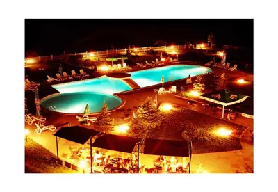 an overhead view of two swimming pools at night at Riviera Complex 6 in Sveti Vlas