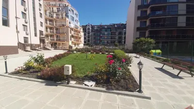 a park in the middle of a city with buildings at Studio Sea Pearl in Pomorie
