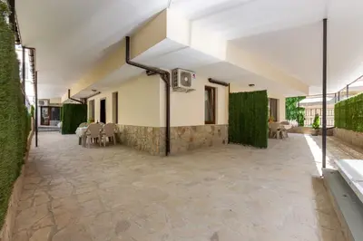 an external view of a house with a patio at Apartments Flora 1 in Burgas City