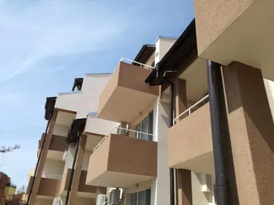 an image of an apartment building with boxes at Siana House in Ravda