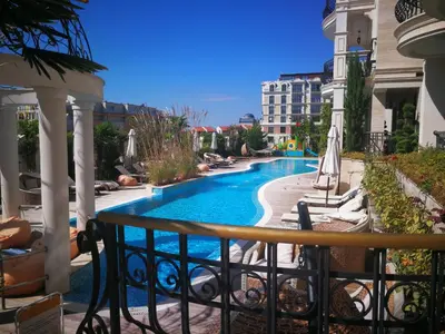 a view of a swimming pool from a balcony at Harmony Suites Apartment in Sveti Vlas