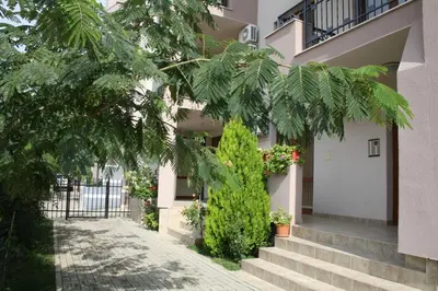 a building with stairs and plants in front of it at Alex Deluxe Apartments in Sunny Beach