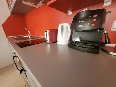 a kitchen with a coffee maker on a counter at Sirena Holidays in Ravda