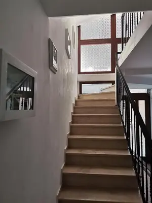 a staircase in a house with a stair case at Guest Rooms Melsambria in Nesebar