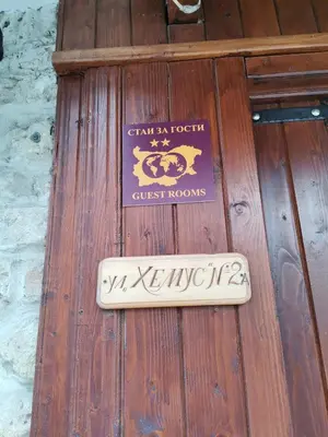 a sign on a wooden door of a guest room at Guest Rooms Melsambria in Nesebar