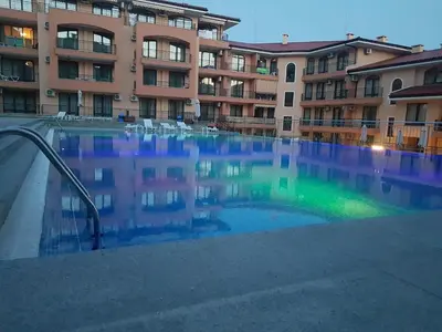 a large swimming pool in front of a building at Private Apartment in Star Dreams Complex in Sveti Vlas