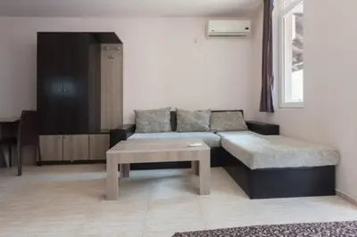 a living room with a couch and a coffee table at Santa Sofia Studio in Sunny Beach