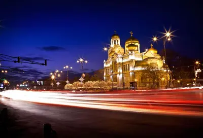a large building with lights in front of it at night at Cathedral Guesthouse in Varna City