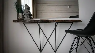a console table in a room with a black chair at The Mint Villa - Saint Vlas in Sveti Vlas