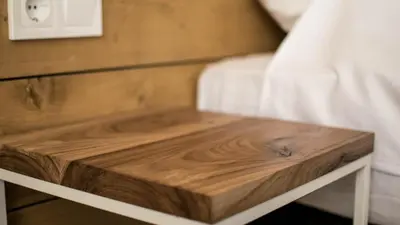 a wooden end table in a bedroom with a bed at The Mint Villa - Saint Vlas in Sveti Vlas