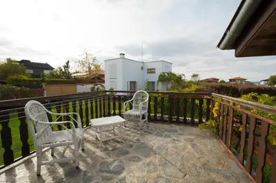 two chairs and a table on a balcony at Art Provence House in Lozenets