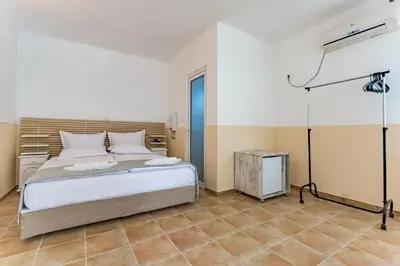 a bedroom with a bed in a room at St Anastasia Hotel in Burgas City